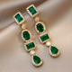 Dangling Emerald Gold Earrings